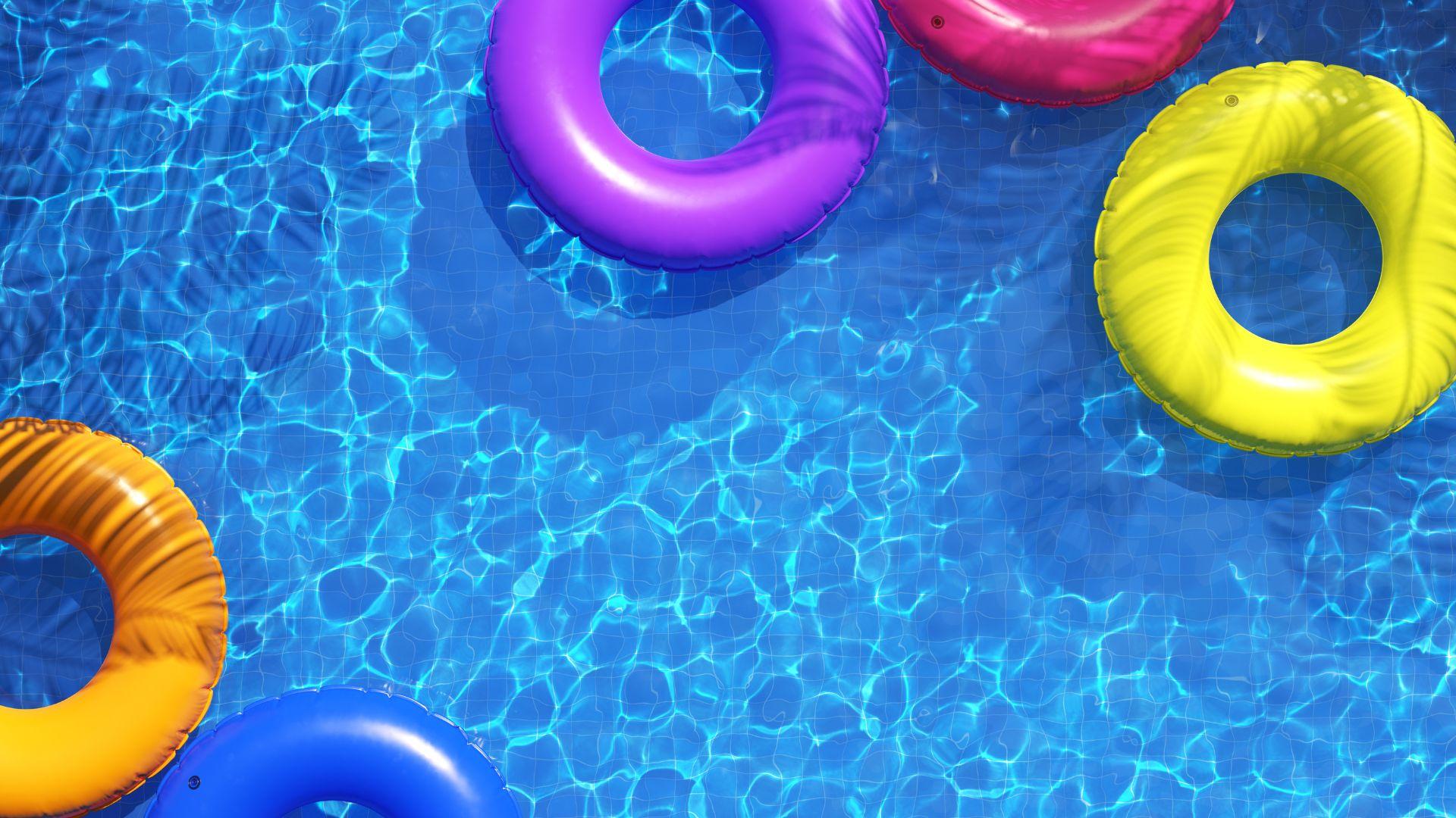 swimming pool with bright inflatable rings