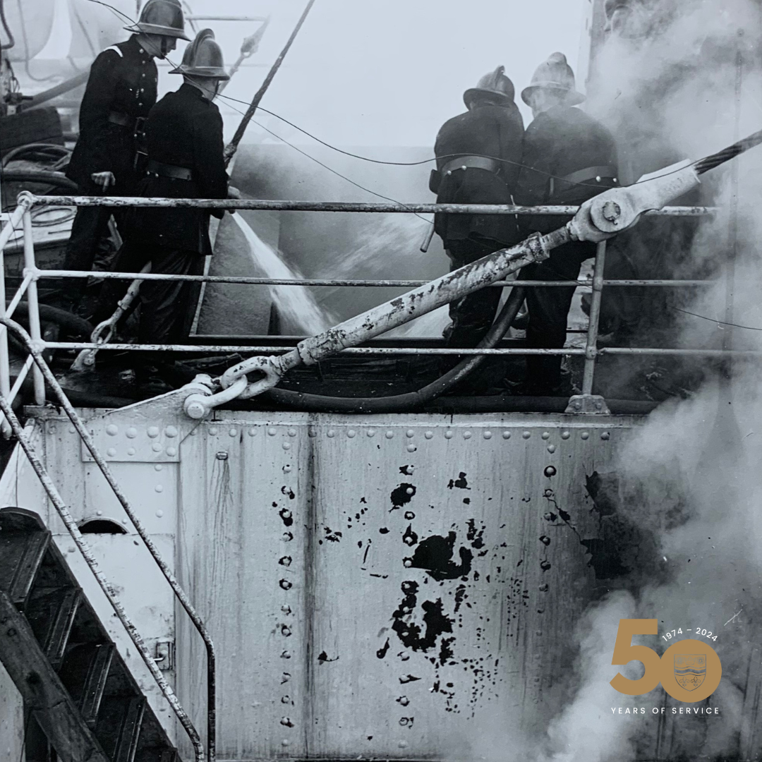 Firefighters on the deck of the ship